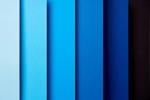 Modèle de feuilles de papier se chevauchant dans des tons bleus — Photo de stock