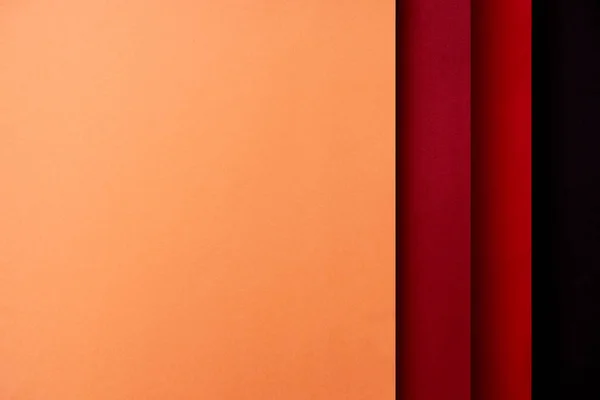 Fond abstrait avec feuilles de papier dans les tons rouge et orange — Photo de stock