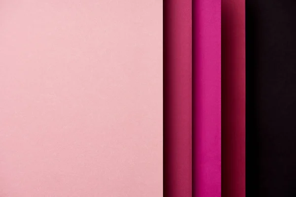 Patrón de hojas de papel superpuestas en tonos rosados - foto de stock