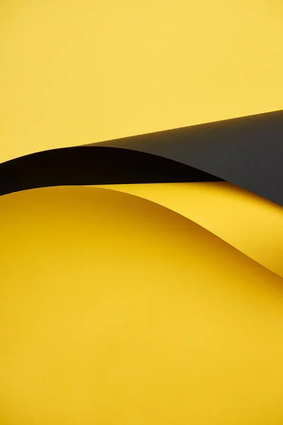 Close-up view of beautiful bright yellow and black paper background — Stock Photo