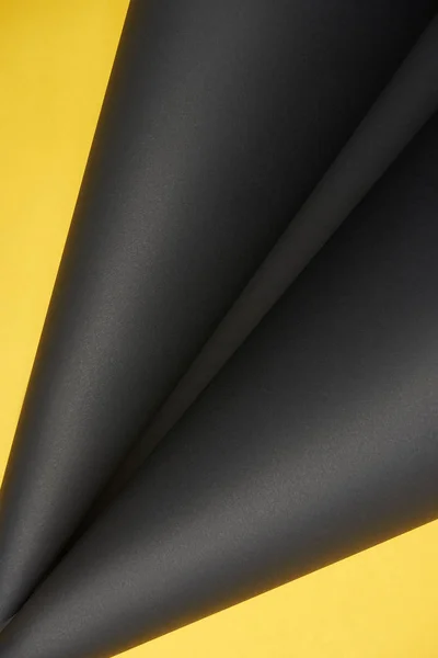 Close-up view of abstract yellow and black paper background — Stock Photo