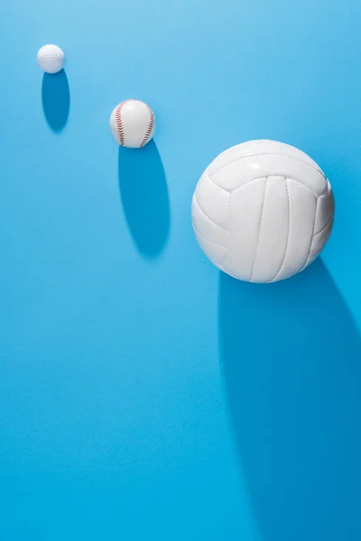 Top view of arranged various balls on blue background — Stock Photo