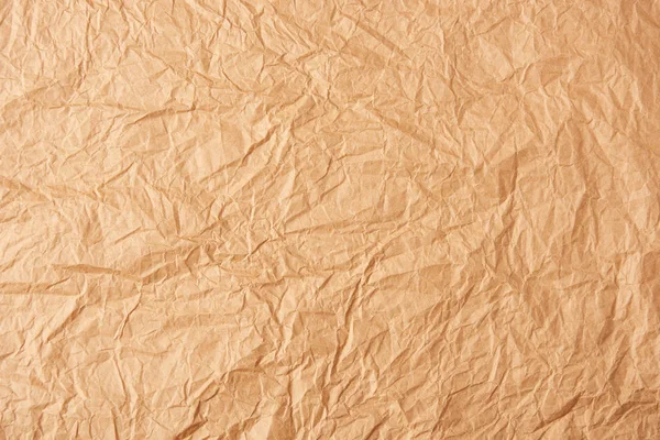 Vollrahmen aus beige zerknülltem Papier als Hintergrund — Stockfoto