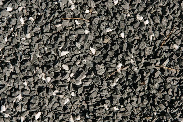 Tiro quadro completo de pedras de seixos pretas para o fundo — Fotografia de Stock