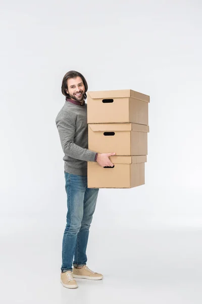 Homme tenant pile de boîtes en carton isolé sur blanc — Photo de stock