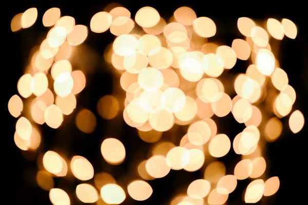 Luci bokeh sfocate luminose su sfondo nero — Foto stock