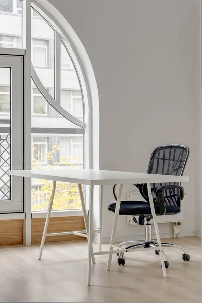 White desk and black chair in classroom at modern kindergarten — Stock Photo