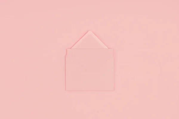 Top view of open pink letter isolated on pink background — Stock Photo