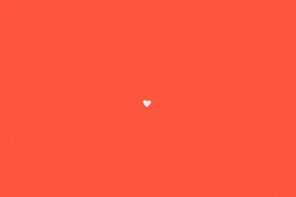 Small single white heart symbol isolated on red background — Stock Photo