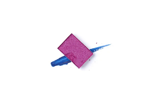 Top view of eyeshadow of purple color with blue stroke on white background — Stock Photo