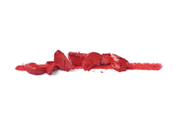 Close up view of smashed red lipstick on white background — Stock Photo