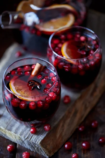 High angle view of homemade mulled wine with cranberries on table in kitchen — Stock Photo