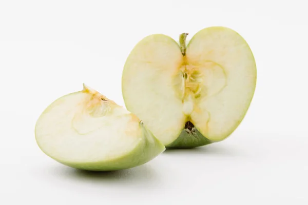 Cut ripe green apple on white background — Stock Photo