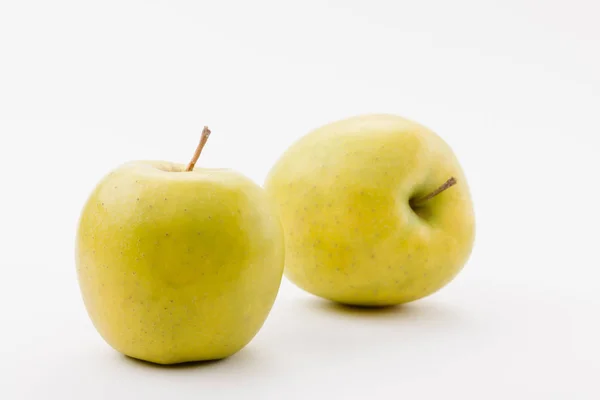 Tasty golden delicious apples on white background — Stock Photo