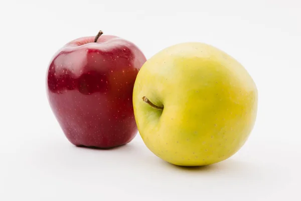 Fresh golden and red delicious apples on white background — Stock Photo