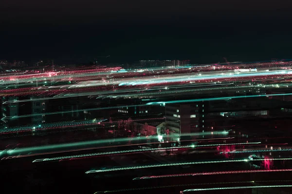 Long exposure of night cityscape with defocused bright illumination — Stock Photo