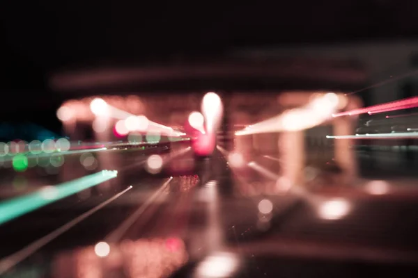 Long exposure of bright colorful lights at night — Stock Photo