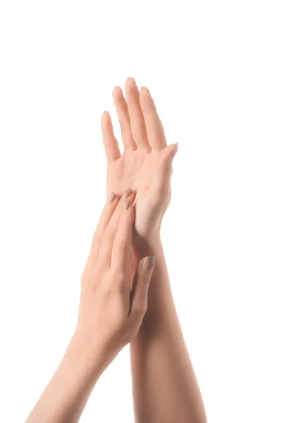 Частковий вигляд жіночих рук, які торкаються ізольовані на білому — стокове фото