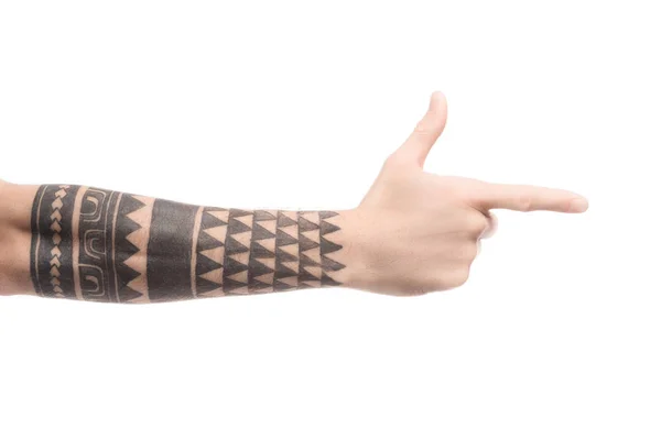 Corte vista de homem tatuado apontando para a direita com o dedo isolado no branco — Fotografia de Stock