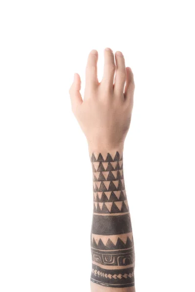 Vista superior del hombre tatuado agarrando algo con la mano aislada en blanco - foto de stock