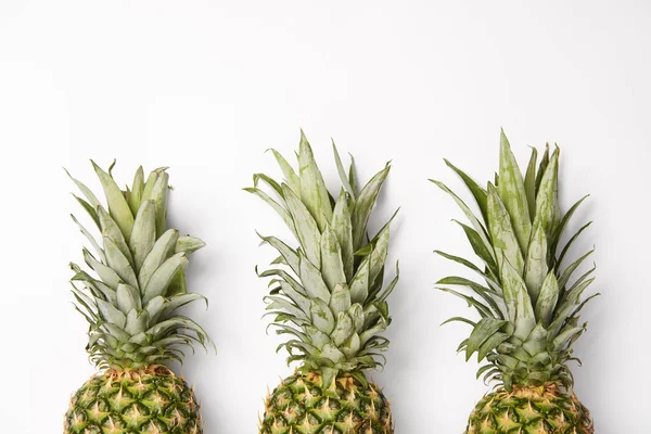 Fresh, organic and tasty pineapples on white  background — Stock Photo