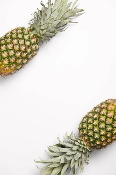 Fresh, sweet organic pineapples on white background — Stock Photo