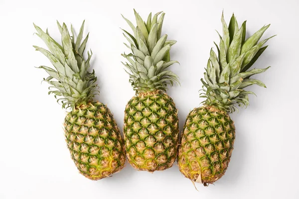 Organic, juicy and sweet pineapples on white background — Stock Photo