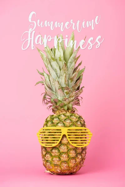 Funny sweet pineapple in sunglasses with summertime happiness lettering on pink background — Stock Photo
