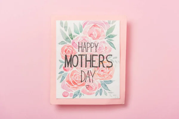 Joyeuse carte de vœux de la fête des mères avec des fleurs sur fond rose — Photo de stock
