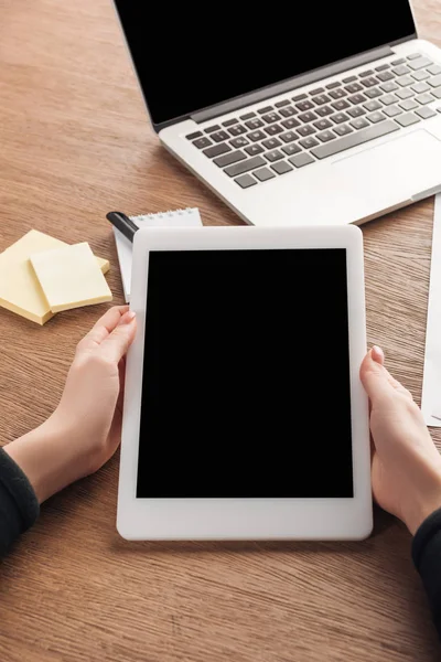 Partial view of woman using digital tablet with blank screen at workplace — Stock Photo