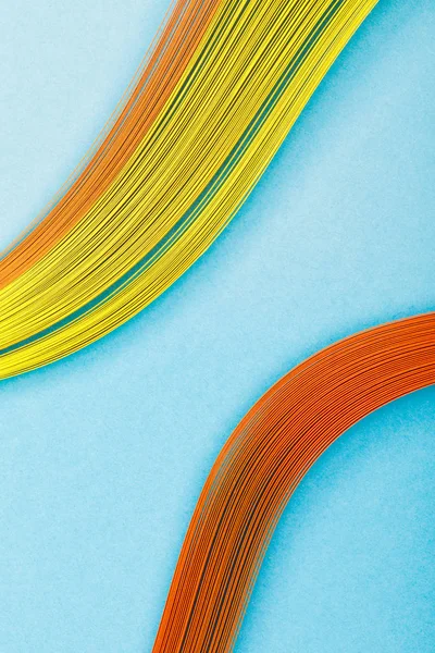 Close up of multicolored abstract lines on blue background — Stock Photo