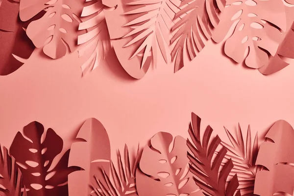 Top view of paper cut palm leaves on pink background with copy space — Stock Photo