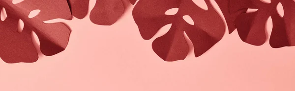 Top view of paper cut palm leaves on pink background — Stock Photo