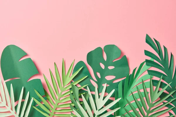 Top view of green palm leaves on pink background with copy space — Stock Photo