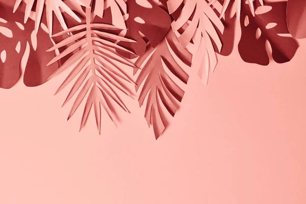 Top view of colorful decorative paper cut palm leaves on pink background, panoramic shot — Stock Photo