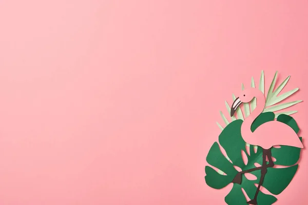 Top view of paper cut flamingos on green palm leaves on pink background with copy space — Stock Photo