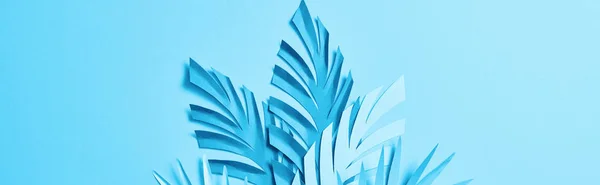 Top view of blue minimalistic paper cut palm leaves on blue background with copy space, panoramic shot — Stock Photo