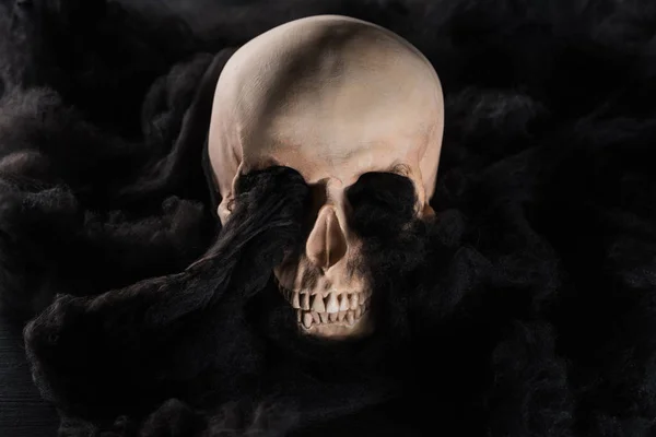 Spooky human skull with black dark clouds, Halloween decoration — Stock Photo