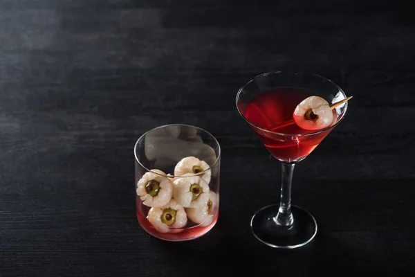 Red decorated Halloween cocktail on black background — Stock Photo