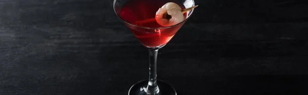 Panoramic shot of red decorated Halloween cocktail on black background — Stock Photo