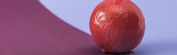 Panoramic shot of red colorful painted pumpkin on violet and purple background — Stock Photo