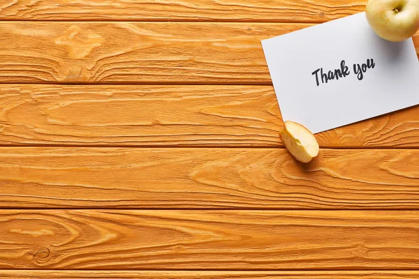 Top view of ripe apples and thank you card on wooden table — Stock Photo