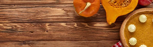 Top view of pumpkin pie served at wooden table for Thanksgiving dinner, panoramic shot — Stock Photo