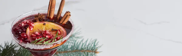 Panoramic shot of christmas cocktail with orange, pomegranate and cinnamon — Stock Photo