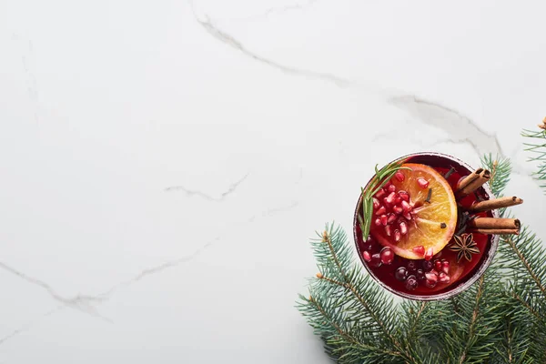 Top view of christmas cocktails with orange, pomegranate, cinnamon — Stock Photo
