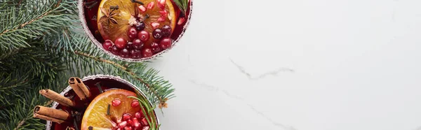Panoramic shot of christmas cocktails with orange, pomegranate, cinnamon — Stock Photo