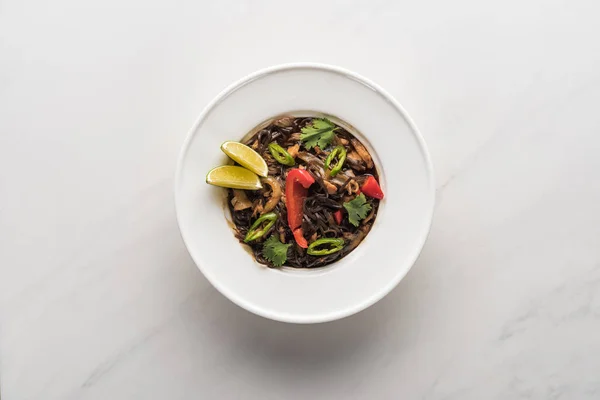 Top view of delicious spicy thai noodles on marble grey surface — Stock Photo