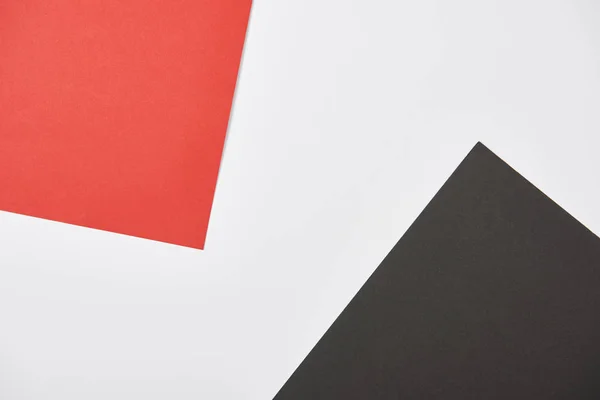 Top view of red, white and black background with copy space — Stock Photo