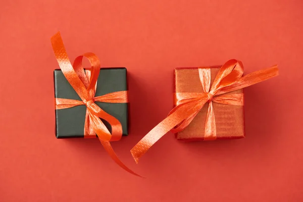 Top view of gift boxes on red background — Stock Photo