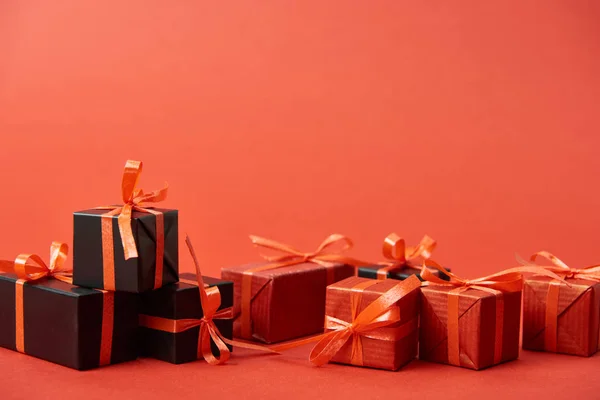 Black friday presents on red background with copy space — Stock Photo